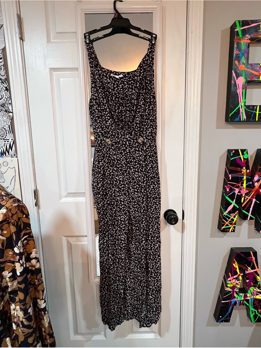Black Floral Sleeveless Jumpsuit with Button-Accented Waist